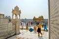 Sikh walking and praying in the Golden Temple, Amritsar Royalty Free Stock Photo