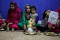 Sikh woman and daughter during dinner