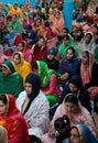 Sikh women and childs inside a temple in Mallorca vertical Royalty Free Stock Photo