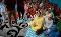 Sikh women and sons inside a temple in Mallorca to celebrate a Sikh festivity