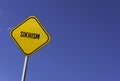 Sikhism - yellow sign with blue sky background