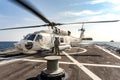 Sikorsky MH-60S Seahawk helicopter lands on the flight deck of the HTMS. Bhumibol Adulyadej Multi role stealth frigate of Royal