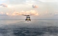 Sikorsky MH-60S Seahawk helicopter of Royal Thai navy flies or hops over the sea surface during the search and rescue at sea Royalty Free Stock Photo