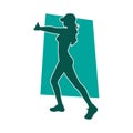 Silhouette of a sporty woman doing gym workout pose. Royalty Free Stock Photo