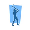 Silhouette of a man in worker costume carrying pick axe tool in action pose. Royalty Free Stock Photo