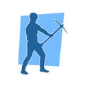 Silhouette of a man in worker costume carrying pick axe tool in action pose. Royalty Free Stock Photo