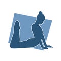 Silhouette of a slim ballet dancer female doing stretching or warming up. Royalty Free Stock Photo