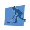 Silhouette of female field hockey athlete in action.