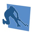 Silhouette of female field hockey athlete in action.