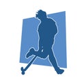 Silhouette of female field hockey athlete in action.