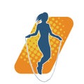 Silhouette of a slim sporty woman doing jump rope workout. Royalty Free Stock Photo