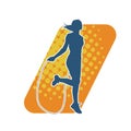 Silhouette of a slim sporty woman doing jump rope workout. Royalty Free Stock Photo
