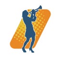 Silhouette of a woman musician playing trumpet brass musical instrument. Royalty Free Stock Photo