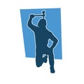 Silhouette of a worker in action pose using his axe tool. Royalty Free Stock Photo