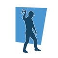 Silhouette of a worker in action pose using his axe tool. Royalty Free Stock Photo