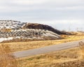 Silage piles on a large dairy farm covered with plastic and cut tires to prevent spoilage. Selective focus, background blur and fo