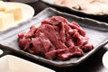 Silced beef heart with tofu on black plate in a hot pot meal Royalty Free Stock Photo