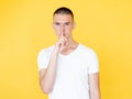 silence gesture conspirator man censor expression Royalty Free Stock Photo