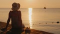 Silence and pacification in the early morning on the sea pier, the girl enjoys loneliness