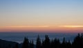 Silent morning in Carpathian montains. Forest silhouettes in mountains at dawn with copy space. Vasness and peace concept.