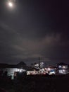 the silent night sky and the night moon that illuminates the houses with its light Royalty Free Stock Photo