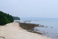 Silent and Serene White Sandy Beach with Rocks and Greenery and Boats at Distance - Kalapathar, Havelock, Andaman, India Royalty Free Stock Photo