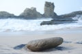 A Silent Stone Amidst the Rolling Waves Royalty Free Stock Photo