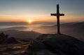 Silent sunrise over cross on misty mountains Royalty Free Stock Photo