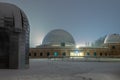 Silesian Planetarium during the blue hour. Beautiful winter scenery. The snow-covered dome of the observatory