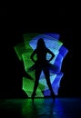 Silhouet ballet dancer girl standing pose in neon light painting