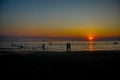 Silhouete people sunset on the beach.