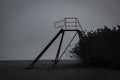 Silhouett of old children slide near pond and rushes Royalty Free Stock Photo