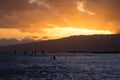 Silhouett of surfers during sunset at Waikiki Beach, Honolulu, Hawaii USA Royalty Free Stock Photo