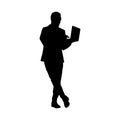 Silhouette of a Man Leaning with Laptop in Hand Royalty Free Stock Photo