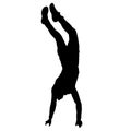 Silhouette of an acrobat standing on hands, on a white background