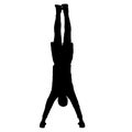 Silhouette of an acrobat standing on hands, on a white background