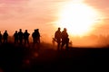 Silhouette action soldiers walking hold weapons the background is smoke and sunset and white balance ship effect dark Royalty Free Stock Photo