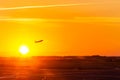 Silhouette of aeroplane, plane, take off on air at sunset time w Royalty Free Stock Photo