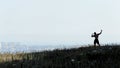 Silhouette of african american athletic man with naked torso posing on the rock. Royalty Free Stock Photo