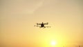 Silhouette, Agricultural drone in the sky with evening light