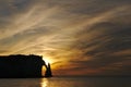 Silhouette of the Aiguille d'Etretat, Falaise d'Aval, with a Beautiful and dramatic sunset at Ãâ°tretat (France