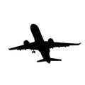 silhouette of the aircraft coming in to land with the landing gear released Royalty Free Stock Photo