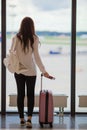 Silhouette of airline passenger in an airport lounge waiting for flight aircraft Royalty Free Stock Photo