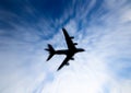 Silhouette of airplane flying on the sky, the image in Zoom blurred for background. Royalty Free Stock Photo