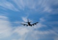 Silhouette of airplane flying on the sky, the image in Zoom blurred for background. Royalty Free Stock Photo