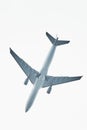 Silhouette of an airplane on sky background. Commercial airplane jetliner flying above clouds in beautiful day light. Flight trave Royalty Free Stock Photo