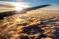 Silhouette of Airplane Wing Against Golden Sunrise Royalty Free Stock Photo