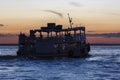 Silhouette of Amazon wooden boat on Rio Negro in Manaus, Brazil