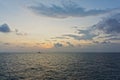 Silhouette of an anchor handling tug boat at oil field during sunrise