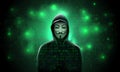 Silhouette anonymous computer hooded hacker on green background with binary code. Anonymous hacker activist group. hacking